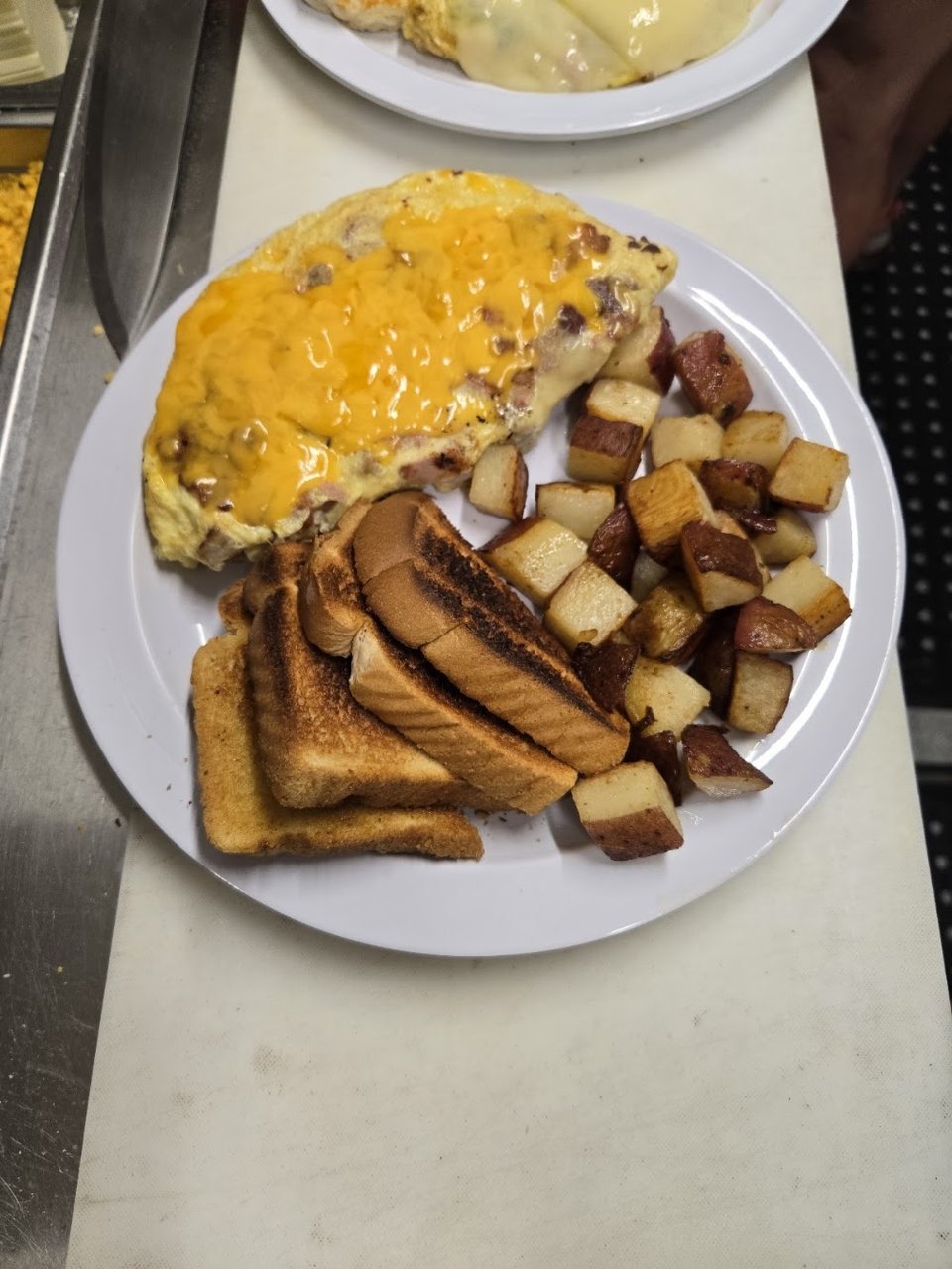 Printed diner menu with sandwiches and eggs